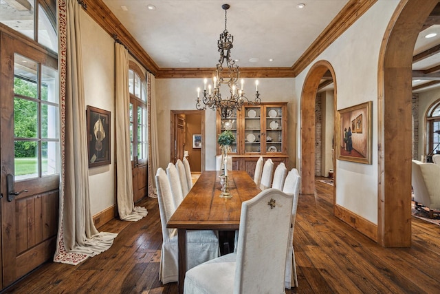 3 E Rivercrest Dr, Houston, TX 77042 - dining space with arched walkways, a chandelier, dark wood-type flooring, and ornamental molding