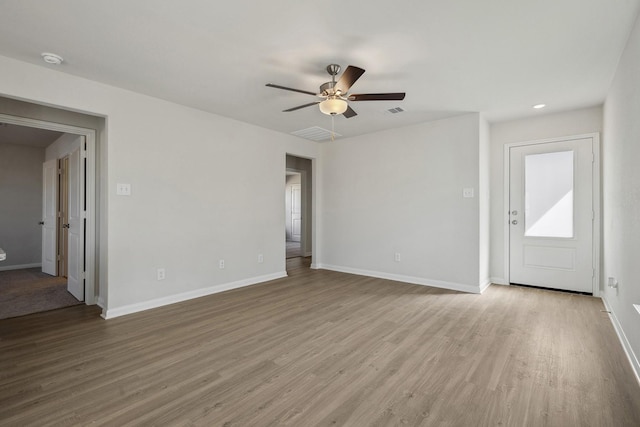 396 Tejas Trl, Waller, TX 77484 - unfurnished room featuring a ceiling fan, wood finished floors, and a smoke detector