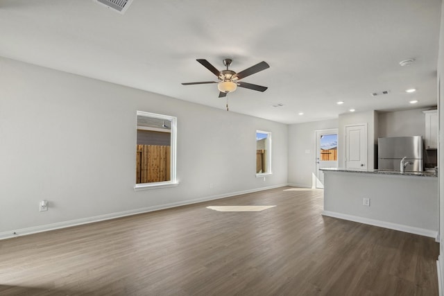 396 Tejas Trl, Waller, TX 77484 - unfurnished living room featuring a ceiling fan, recessed lighting, and dark wood-type flooring