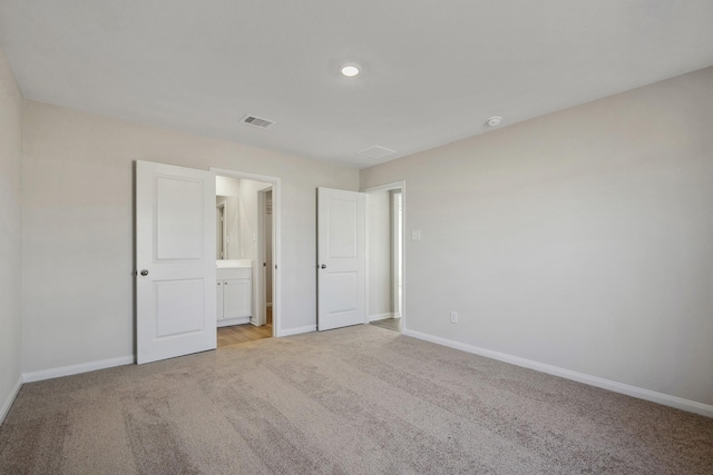 396 Tejas Trl, Waller, TX 77484 - unfurnished bedroom featuring light colored carpet and ensuite bathroom
