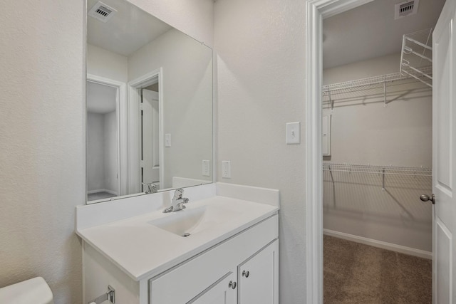396 Tejas Trl, Waller, TX 77484 - bathroom featuring vanity and a walk in closet