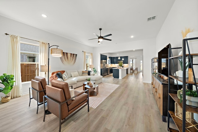 10722 Sky Creek Ln, Beasley, TX 77417 - living area with plenty of natural light, light wood-style flooring, ceiling fan, and recessed lighting