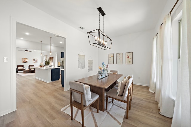 10722 Sky Creek Ln, Beasley, TX 77417 - dining area featuring light wood-type flooring, a chandelier, ceiling fan, and recessed lighting