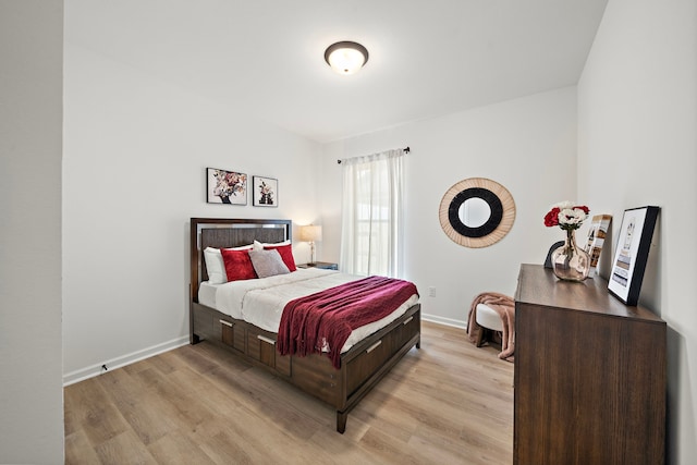 10722 Sky Creek Ln, Beasley, TX 77417 - bedroom with light wood-type flooring and baseboards