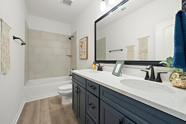 10722 Sky Creek Ln, Beasley, TX 77417 - full bath with double vanity, wood finished floors, and washtub / shower combination