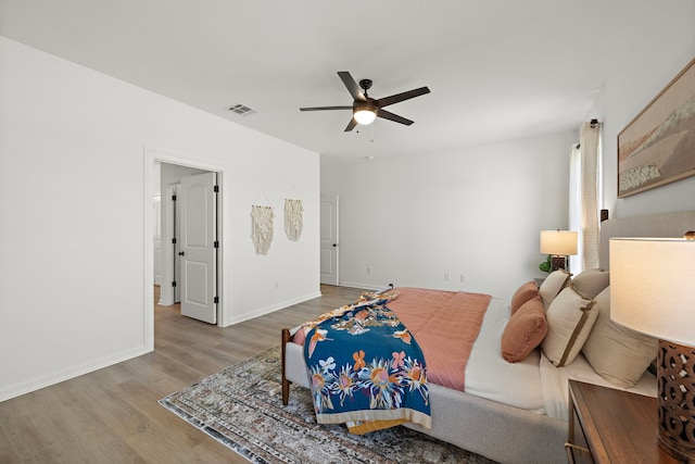10722 Sky Creek Ln, Beasley, TX 77417 - bedroom with wood finished floors and a ceiling fan