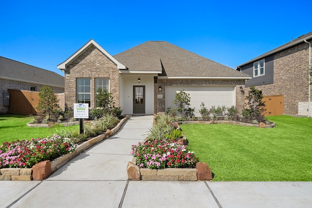 10722 Sky Creek Ln, Beasley, TX 77417 - view of front of property with brick siding, an attached garage, concrete driveway, and a shingled roof