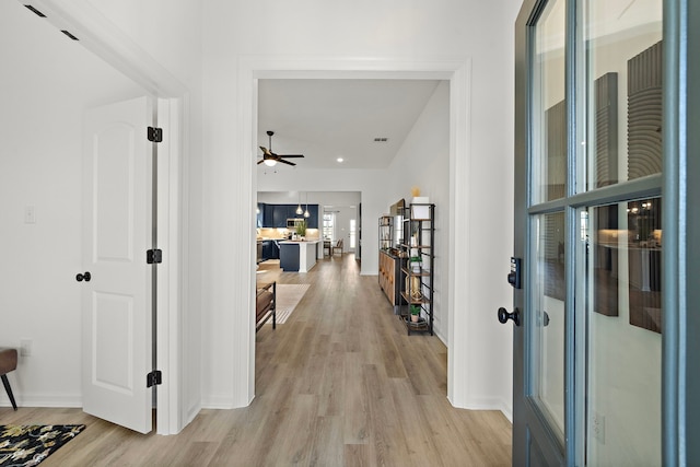 10722 Sky Creek Ln, Beasley, TX 77417 - hallway with light wood-style floors and baseboards