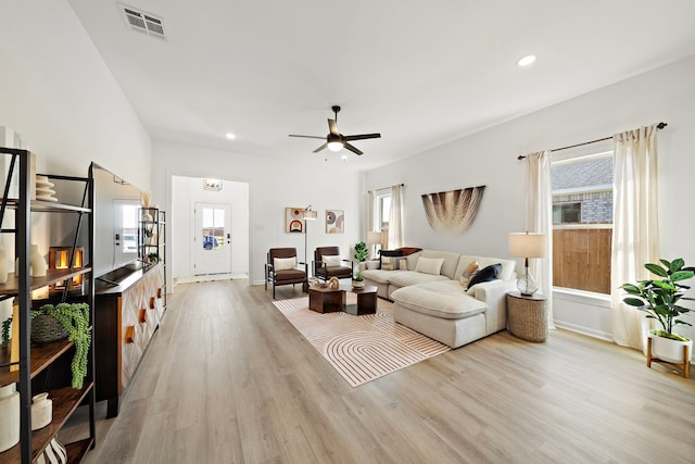 10722 Sky Creek Ln, Beasley, TX 77417 - living area featuring plenty of natural light, light wood-style flooring, a ceiling fan, and recessed lighting