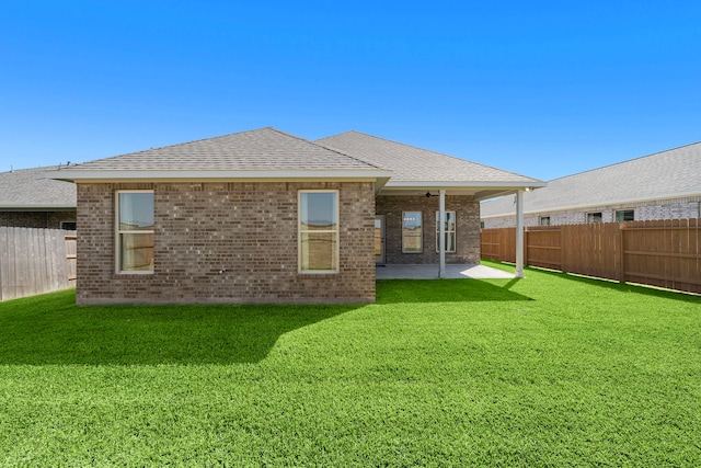 10722 Sky Creek Ln, Beasley, TX 77417 - rear view of house featuring a fenced backyard, a patio, brick siding, and a ceiling fan