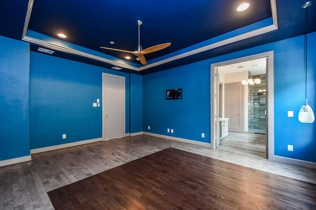 4292 Childress St, Houston, TX 77005 - empty room featuring a tray ceiling, ceiling fan, wood finished floors, and recessed lighting