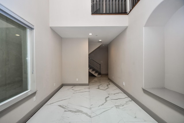 4292 Childress St, Houston, TX 77005 - hall with stairs, marble look tiles, a towering ceiling, and recessed lighting