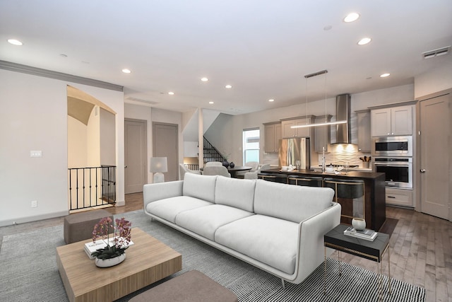 4292 Childress St, Houston, TX 77005 - living area with recessed lighting, stairway, and wood finished floors