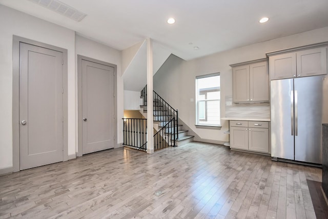 4292 Childress St, Houston, TX 77005 - kitchen featuring freestanding refrigerator, gray cabinetry, light wood-type flooring, recessed lighting, and light countertops