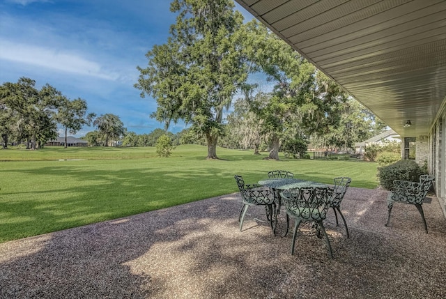 332 N Amherst Dr, West Columbia, TX 77486 - view of patio / terrace with outdoor dining area