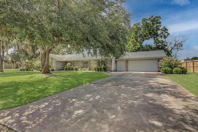332 N Amherst Dr, West Columbia, TX 77486 - ranch-style home with driveway, an attached garage, and stone siding