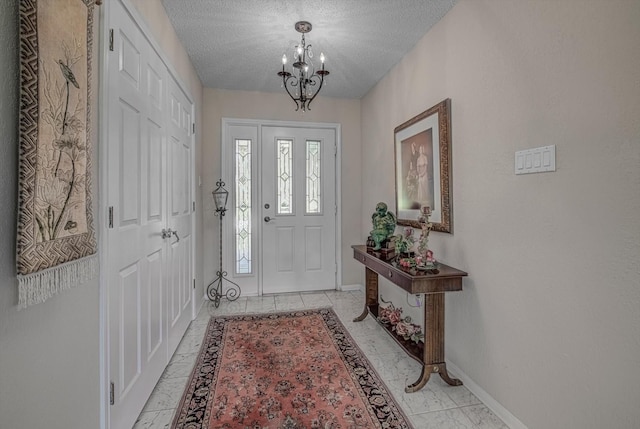 332 N Amherst Dr, West Columbia, TX 77486 - foyer entrance with a chandelier and a textured ceiling
