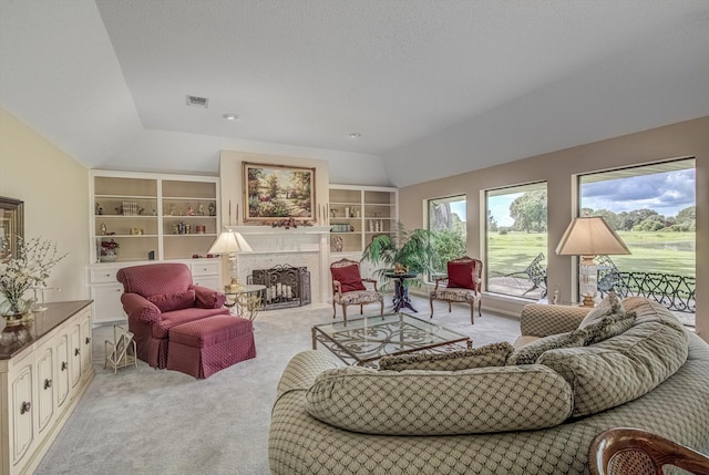 332 N Amherst Dr, West Columbia, TX 77486 - carpeted living room with vaulted ceiling, a fireplace, and built in features