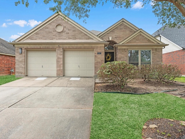2042 Shore Breeze Dr, Pearland, TX 77584 - single story home featuring driveway, an attached garage, brick siding, and a front yard