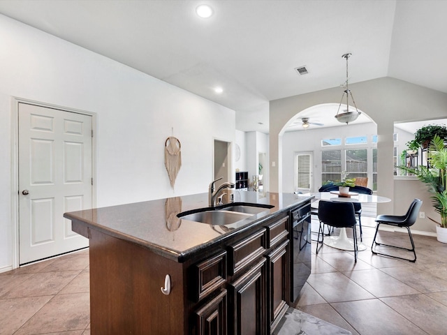 2042 Shore Breeze Dr, Pearland, TX 77584 - kitchen with black dishwasher, a ceiling fan, light tile patterned floors, vaulted ceiling, and decorative light fixtures