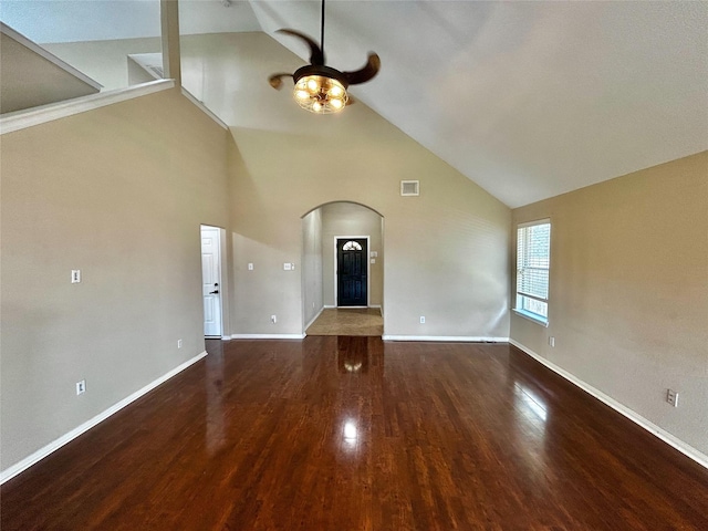 2110 Sterling Oaks Dr, Rosharon, TX 77583 - unfurnished living room with arched walkways, a ceiling fan, wood finished floors, and high vaulted ceiling