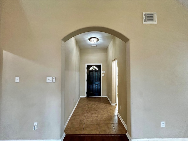 2110 Sterling Oaks Dr, Rosharon, TX 77583 - doorway to outside with arched walkways and tile patterned floors