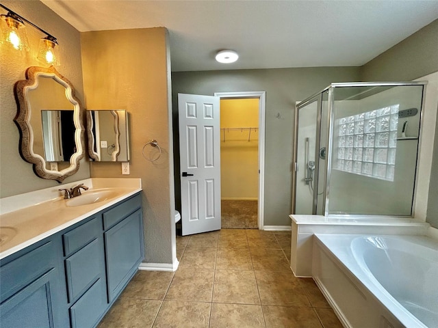 2110 Sterling Oaks Dr, Rosharon, TX 77583 - full bathroom with a stall shower, double vanity, a bath, a walk in closet, and tile patterned flooring