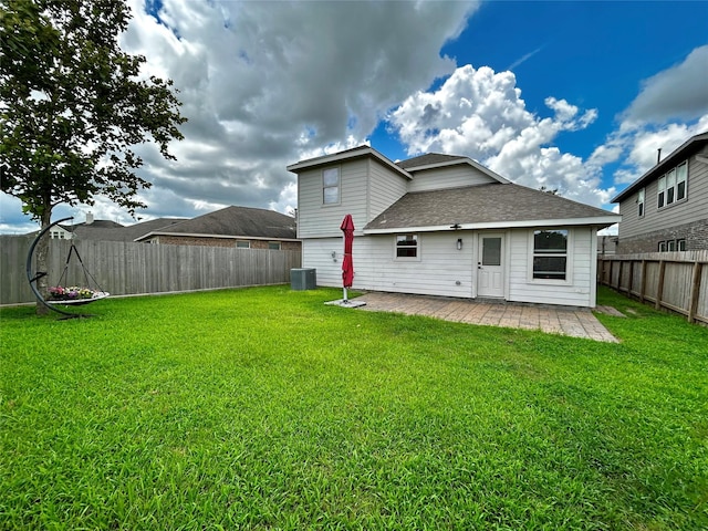 2110 Sterling Oaks Dr, Rosharon, TX 77583 - back of house featuring a patio, a shingled roof, and a fenced backyard