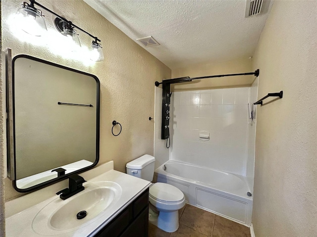 2110 Sterling Oaks Dr, Rosharon, TX 77583 - bathroom with a textured wall, a textured ceiling, vanity, tile patterned floors, and washtub / shower combination