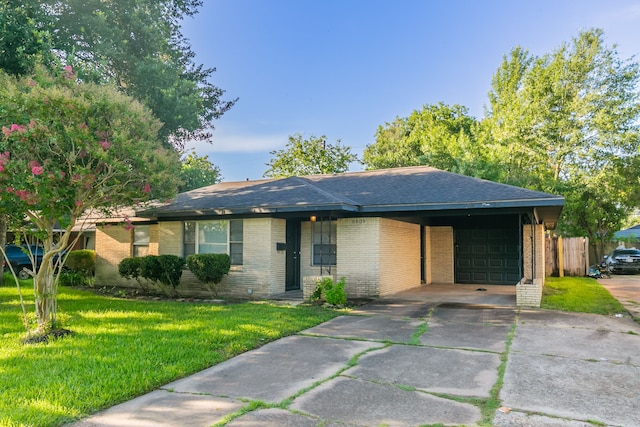 6609 Imogene St, Houston, TX 77074 - view of front of house featuring brick siding, a garage, driveway, and roof with shingles