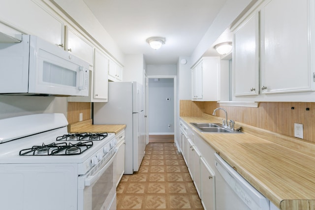 6609 Imogene St, Houston, TX 77074 - kitchen featuring white appliances, light countertops, and white cabinetry