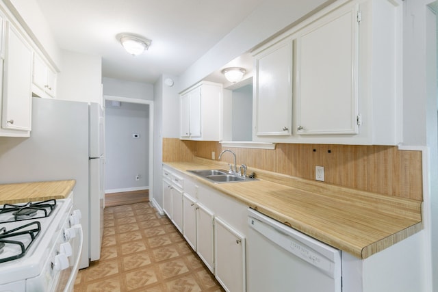 6609 Imogene St, Houston, TX 77074 - kitchen featuring white appliances, white cabinetry, and light countertops