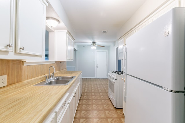 6609 Imogene St, Houston, TX 77074 - kitchen featuring white appliances, ceiling fan, white cabinetry, and light countertops