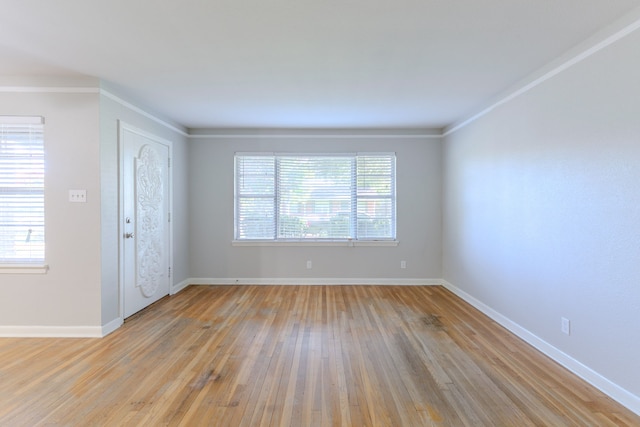 6609 Imogene St, Houston, TX 77074 - unfurnished room featuring light wood-type flooring and crown molding