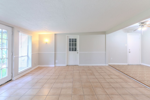 6609 Imogene St, Houston, TX 77074 - spare room with a textured ceiling and ceiling fan