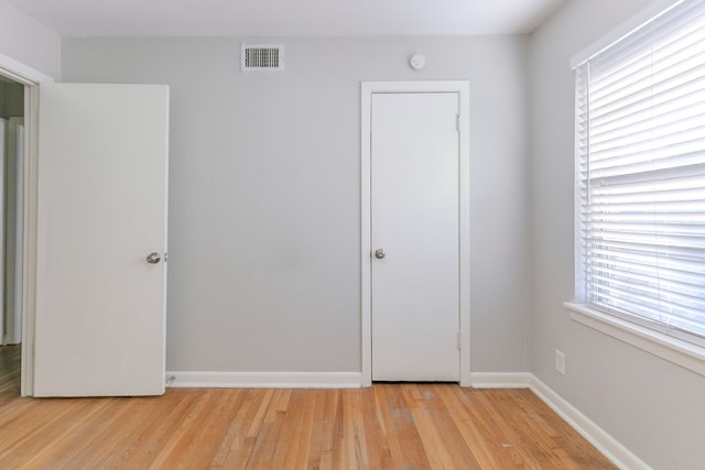 6609 Imogene St, Houston, TX 77074 - unfurnished bedroom with light wood finished floors and baseboards
