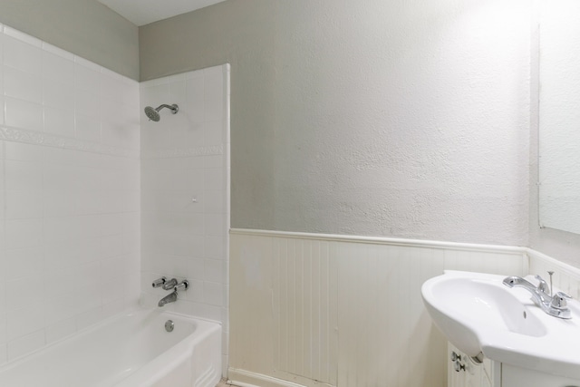 6609 Imogene St, Houston, TX 77074 - full bath featuring bathing tub / shower combination and a wainscoted wall