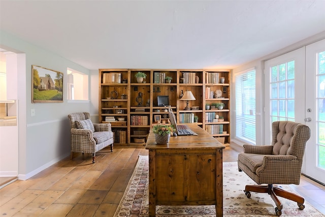 6609 Imogene St, Houston, TX 77074 - living area featuring light wood-style floors and baseboards