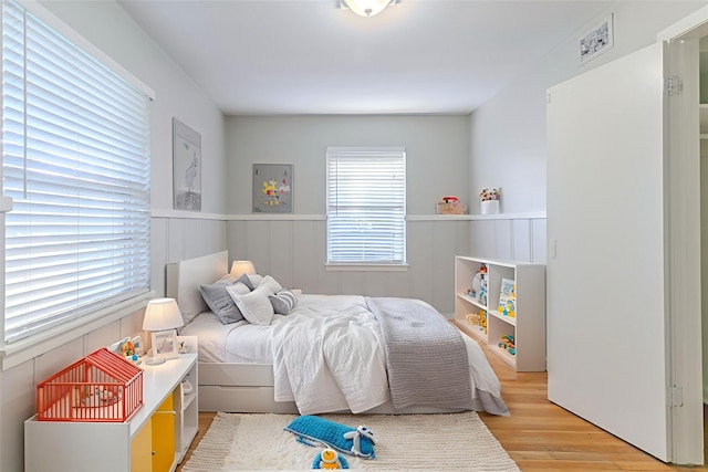 6609 Imogene St, Houston, TX 77074 - bedroom with wood finished floors and wainscoting