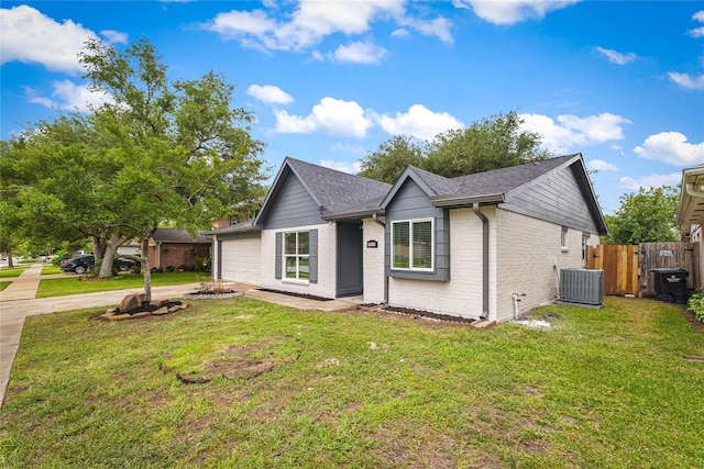 10503 Long River Dr, Sugar Land, TX 77498 - ranch-style home featuring driveway, brick siding, an attached garage, and roof with shingles