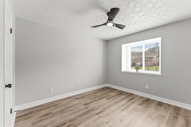 10503 Long River Dr, Sugar Land, TX 77498 - empty room with a textured ceiling, light wood-style flooring, and a ceiling fan