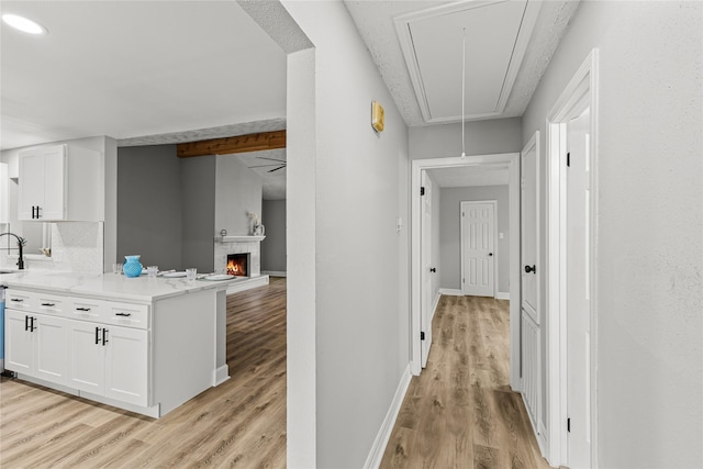 10503 Long River Dr, Sugar Land, TX 77498 - hallway with attic access and light wood finished floors