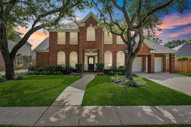 1922 Briarchester Dr, Katy, TX 77450 - georgian-style home with concrete driveway, brick siding, and a garage