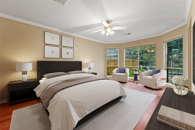 1922 Briarchester Dr, Katy, TX 77450 - bedroom with wood finished floors, ornamental molding, and a ceiling fan