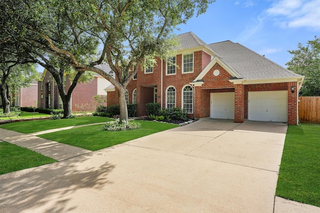 1922 Briarchester Dr, Katy, TX 77450 - view of front of house with brick siding, an attached garage, driveway, and a shingled roof