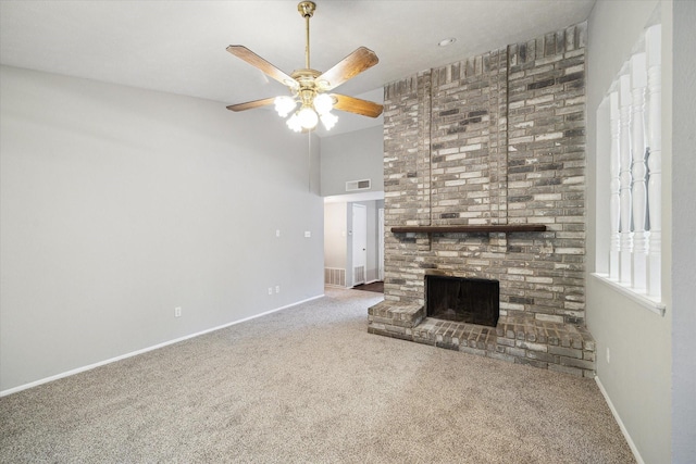 2850 Pheasant Run, Humble, TX 77396 - unfurnished living room with carpet flooring, a fireplace, a ceiling fan, and a towering ceiling