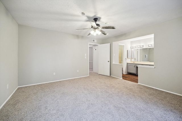 2850 Pheasant Run, Humble, TX 77396 - unfurnished bedroom with carpet flooring, ensuite bathroom, and ceiling fan