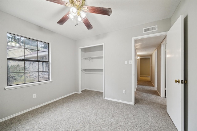 2850 Pheasant Run, Humble, TX 77396 - unfurnished bedroom with carpet floors, a ceiling fan, and a closet