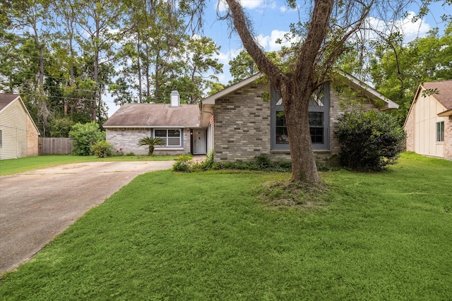 2850 Pheasant Run, Humble, TX 77396 - mid-century home with brick siding, a chimney, and concrete driveway