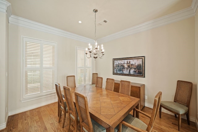 4009 Bellefontaine St, Houston, TX 77025 - dining space with a chandelier, light wood-style floors, and ornamental molding